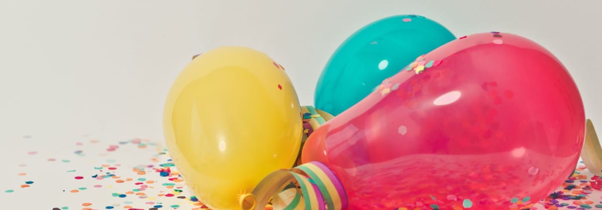yellow pink and blue party balloons